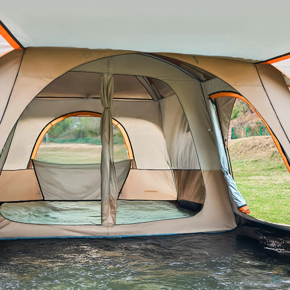 Interior view of khaki Sonuto camping tent showing spacious two-room layout with mesh windows and fabric divider for privacy