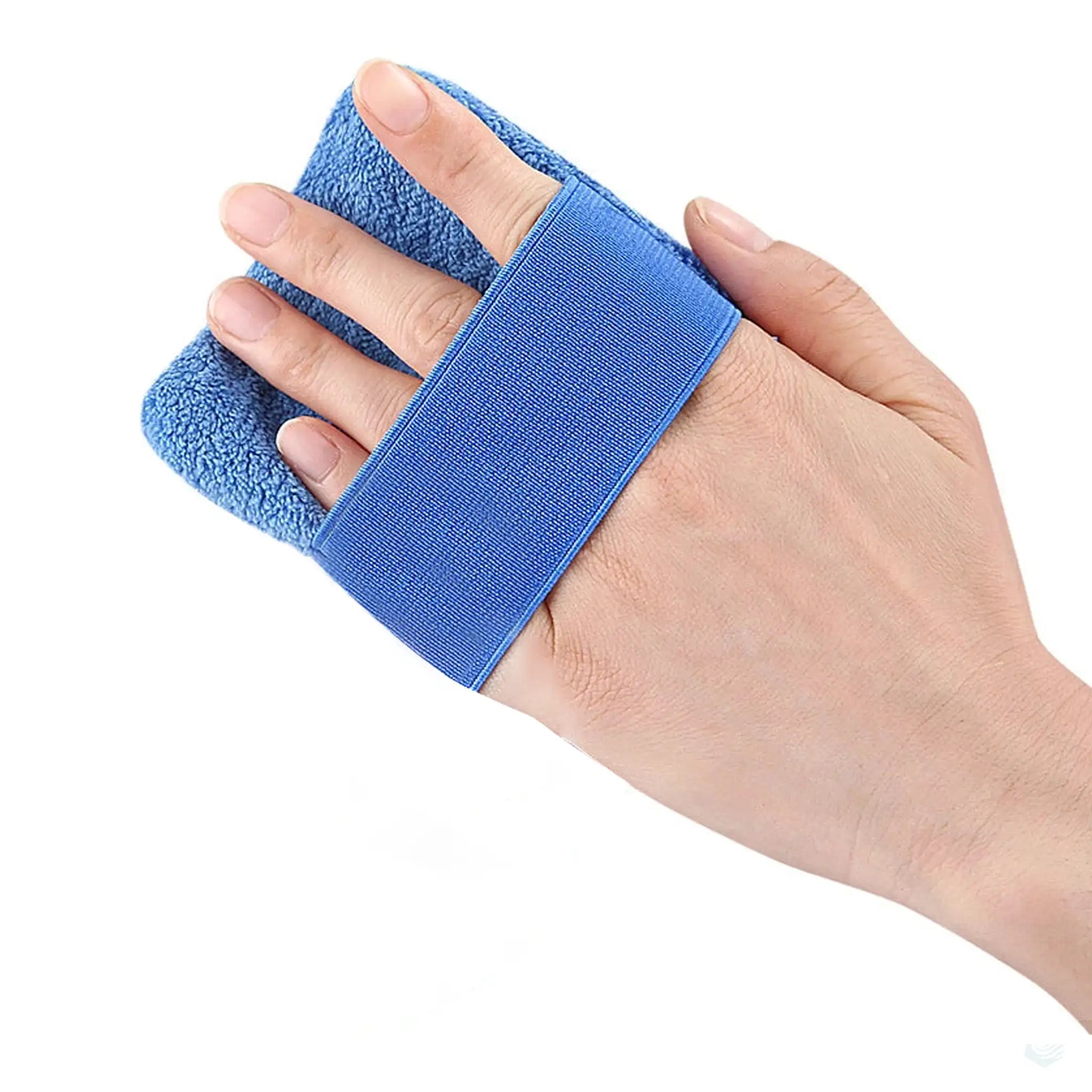 Close-up of a blue beach sand remover hand pad being used on a hand, highlighting the secure elastic strap and soft texture for easy sand removal, with an inset showing the detailed texture of the pad.