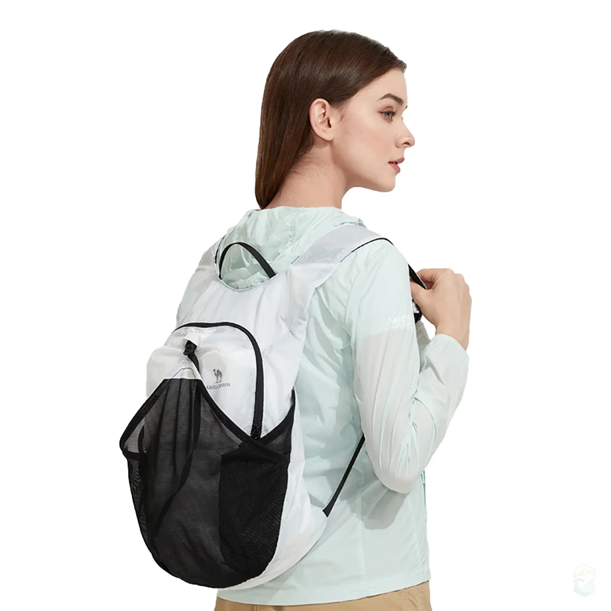 Model wearing Golden Camel 14L white waterproof backpack with black mesh pocket, showcasing lightweight fit and minimalist design for day hiking or city travel