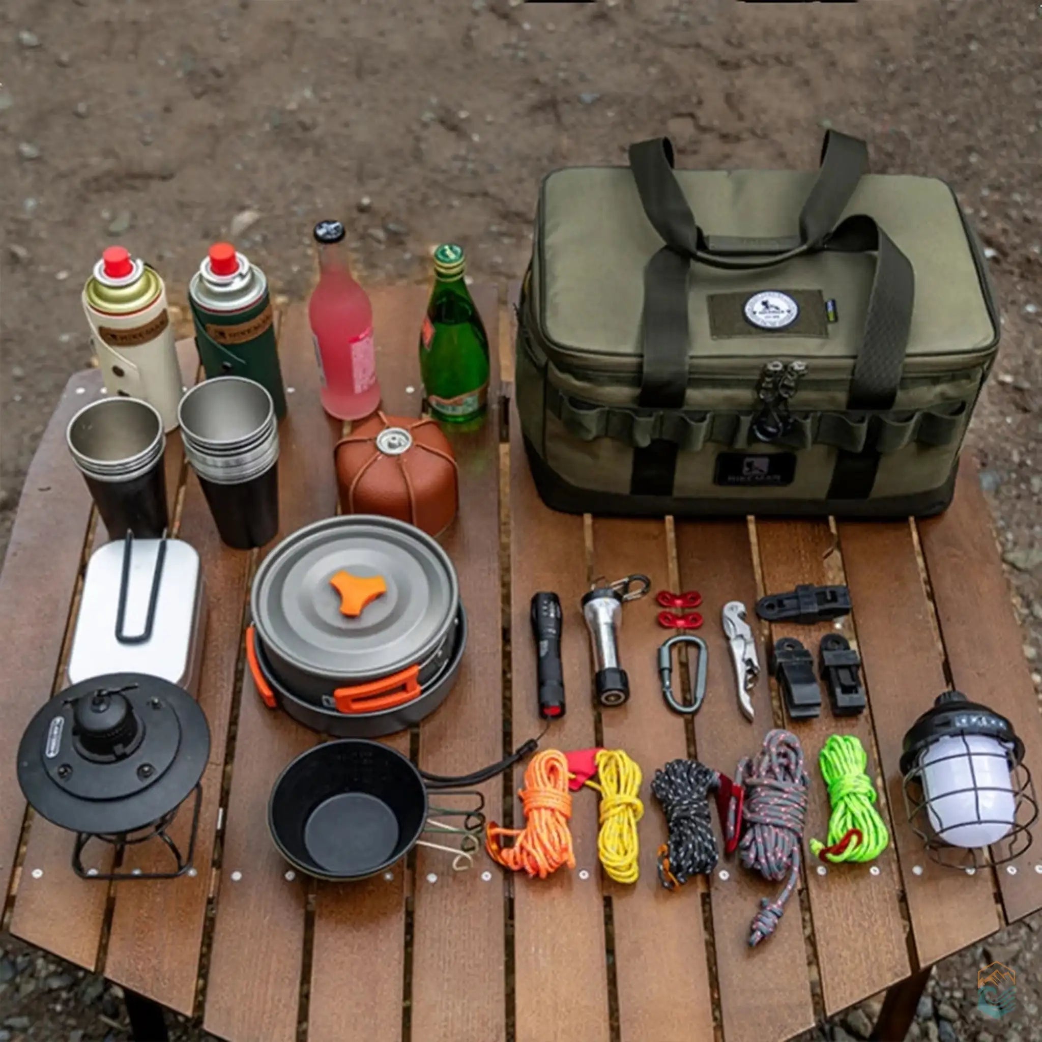 HIKEMAN cooler bag displayed on a wooden table with various camping essentials including cookware, ropes, flashlights, and bottles, perfect for outdoor adventures.