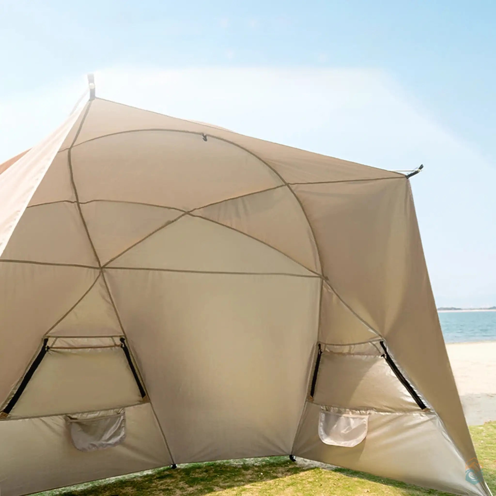 Close-up of the khaki Sonuto beach shelter tent with a silver painted lining, offering UPF60+ protection and waterproofing up to 2500mm+. The tent is designed to effectively block harmful UV rays, making it ideal for sun protection during outdoor activities.