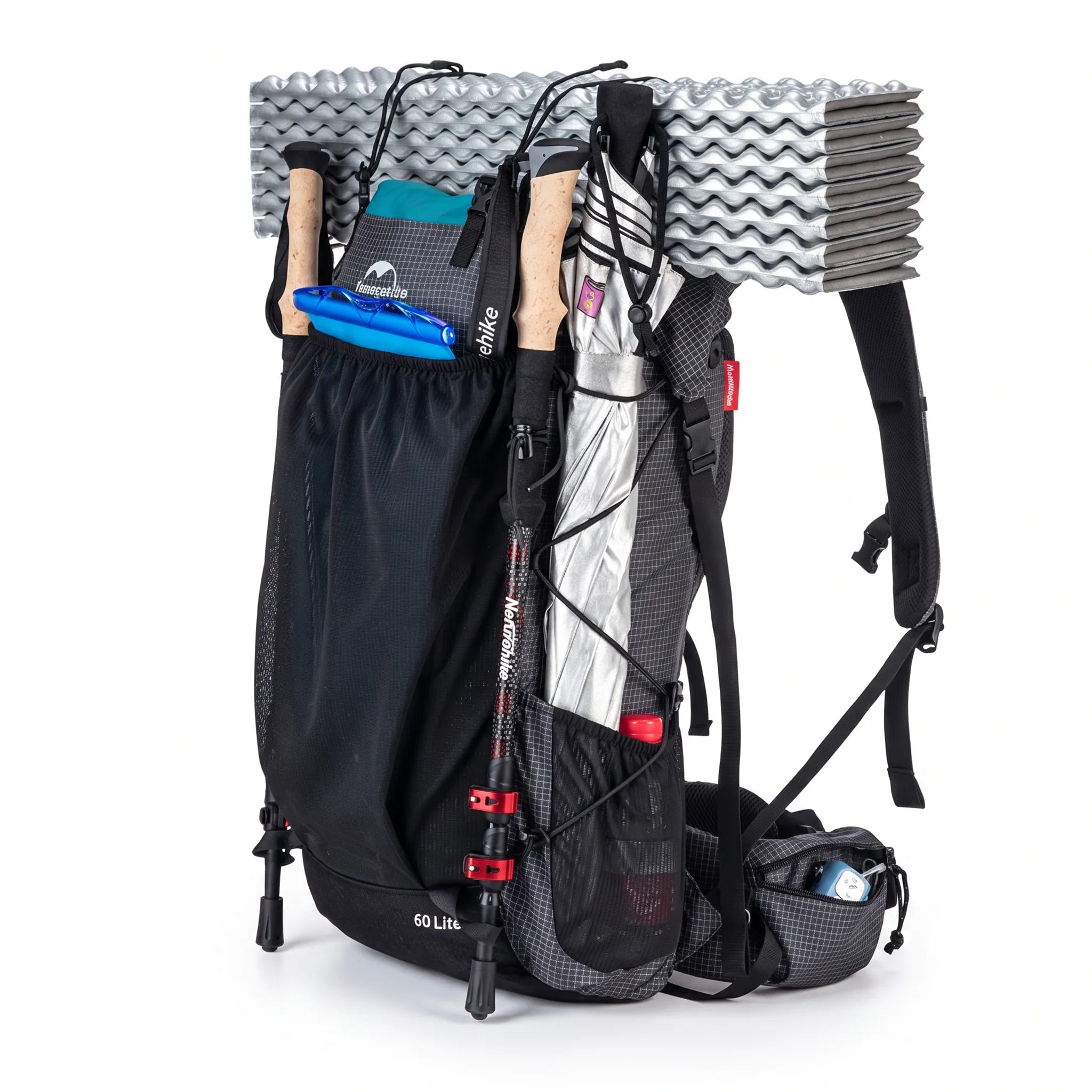 Side view of the Naturehike 60L+5L ultralight hiking backpack fully loaded with a sleeping pad, trekking poles, umbrella, hydration gear, and trail essentials on a white background.