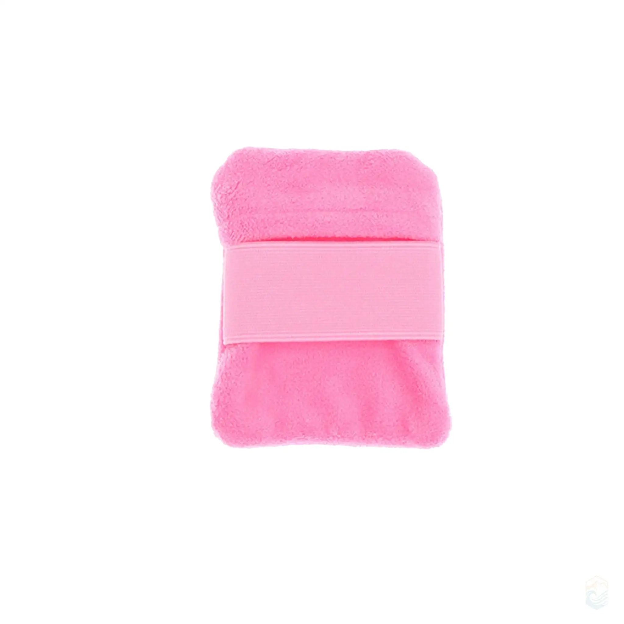 Small pink rectangular beach sand remover hand pad, featuring a soft and plush surface with a matching elastic strap, designed for easy and effective sand removal during beach outings.